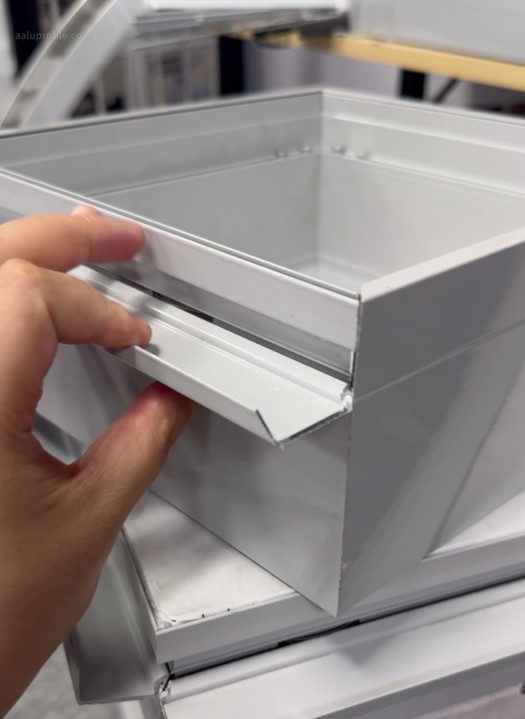 Shape-Memory Alloy Aluminum Channels for Self-Adjusting Architectural Signage